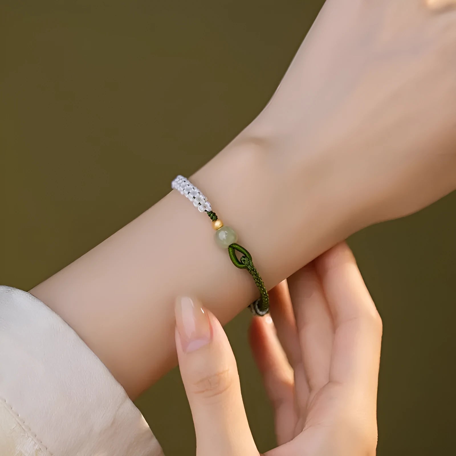 Hetian jade and sterling silver bracelet on a colourful electroplated cord strap.