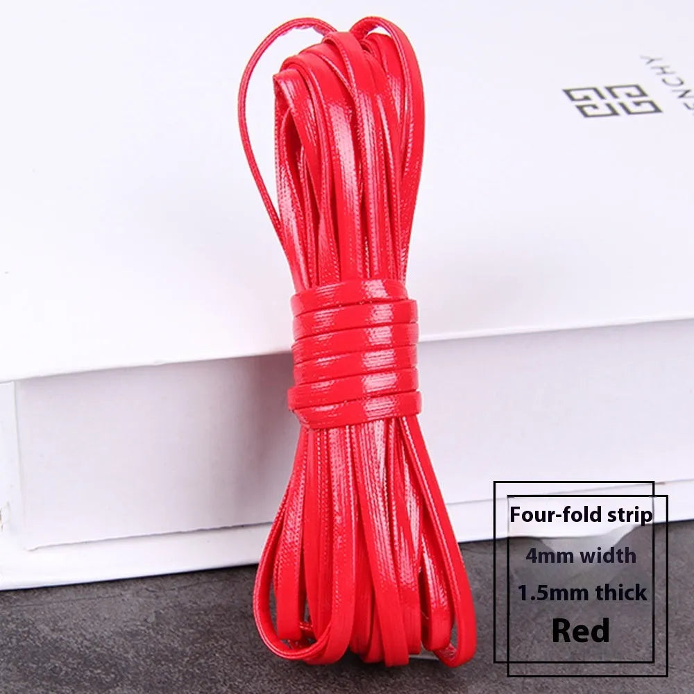 Coils of woven PU leather craft cord in various colours including black, brown, blue, red, and gold.