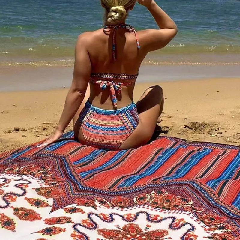 Women's three-piece swimsuit set in pictured colour, showing cutout top, high-waist shorts, and short-sleeved cover-up coat laid flat.