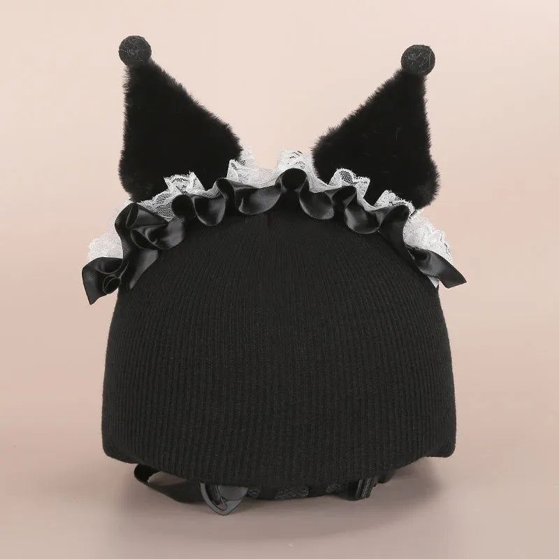 Colourful plush cartoon hat decoration sitting on top of a ski helmet