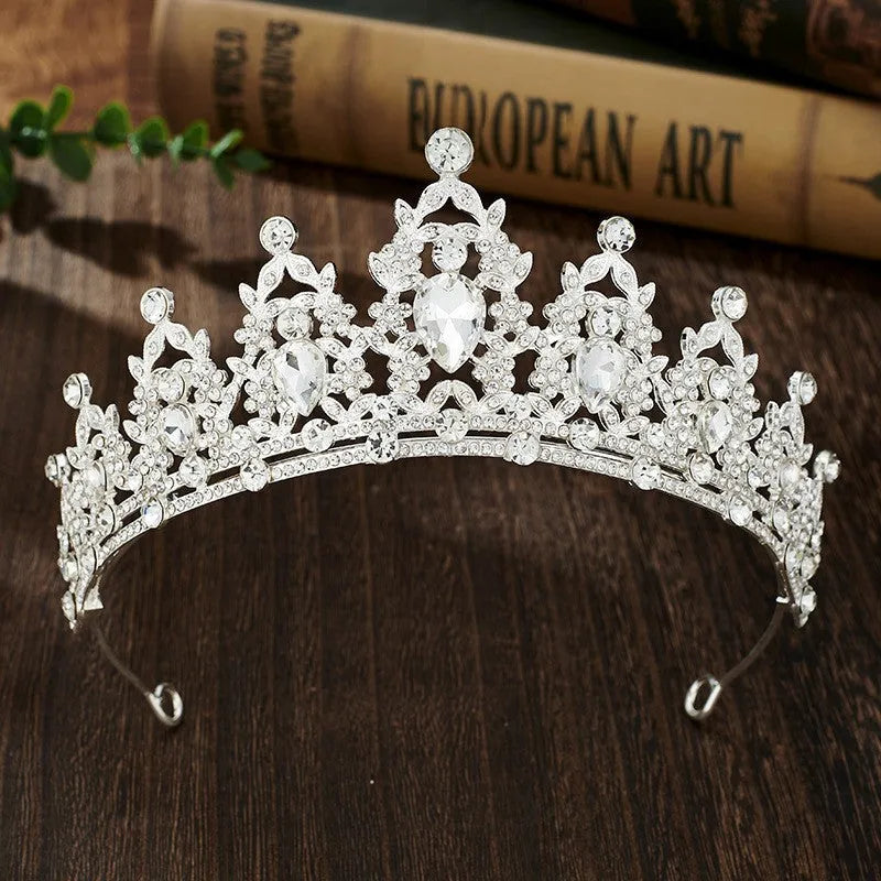 Gold alloy crown-shaped wedding hair headdress with electroplated finish on neutral background