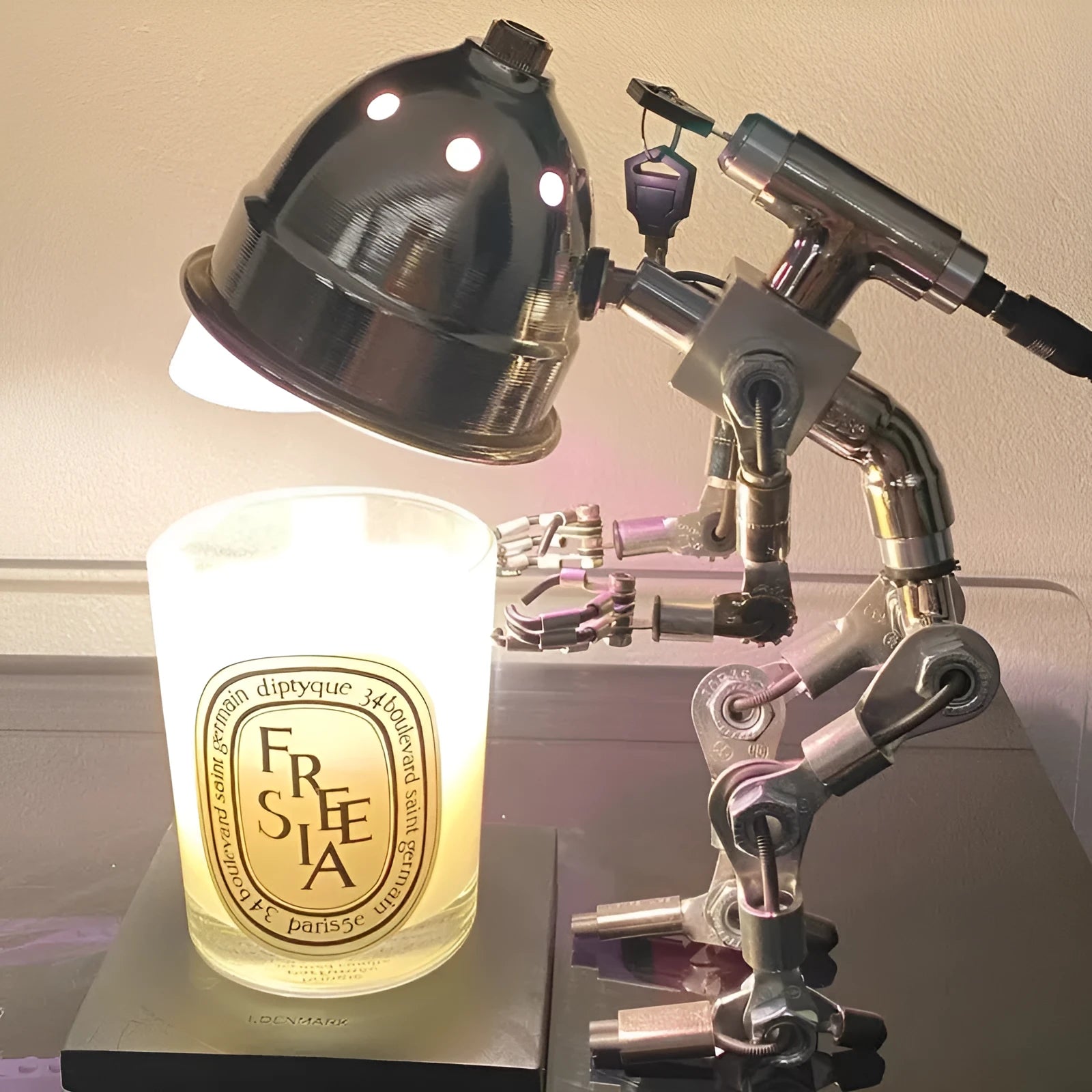 Robot-shaped desk lamp with metallic finish for study lighting