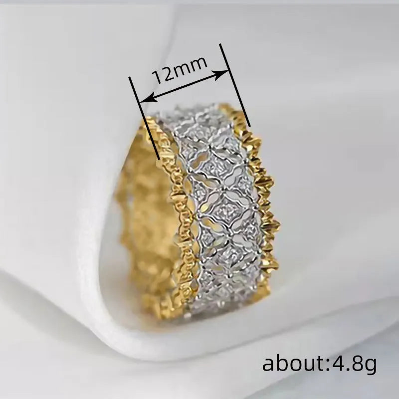 Geometric two-tone gold and silver ring with a round zircon on a copper band.
