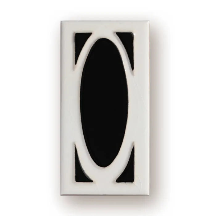 Handmade retro-style ceramic doorplate with large white enamel number 5 on a black background, showing scale.