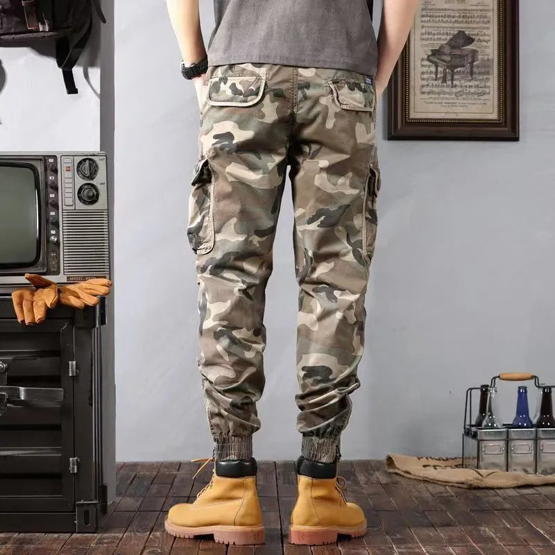 Men's camouflage cargo pants in Army Green, loose tapered fit with pockets, polyester cotton.