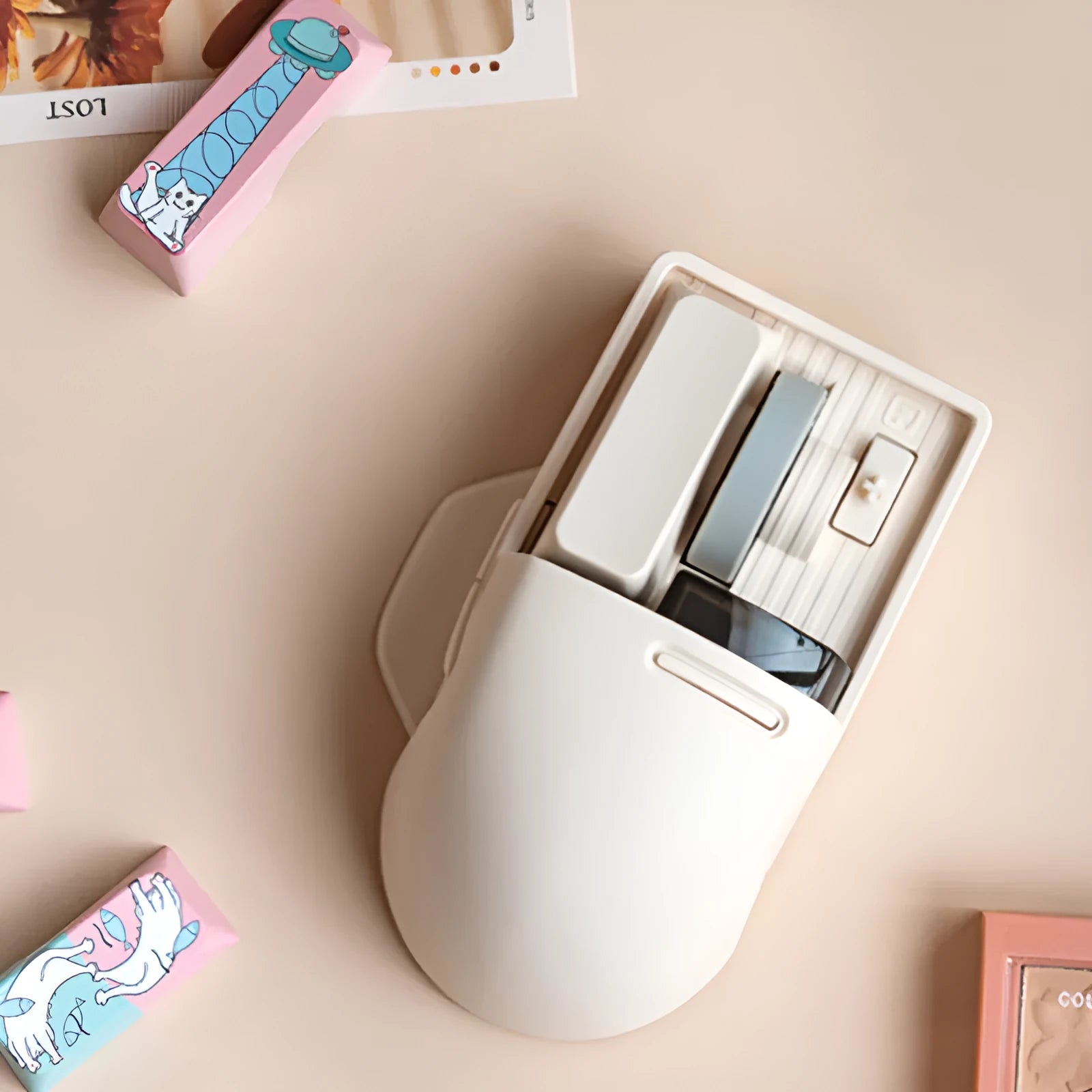 Xiaoqiao Tofu coloured three-mode wireless mouse with ergonomic shape on a desk.