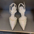 Women's black and silver hollow-cut stiletto heels with a pointed toe and shallow mouth design.