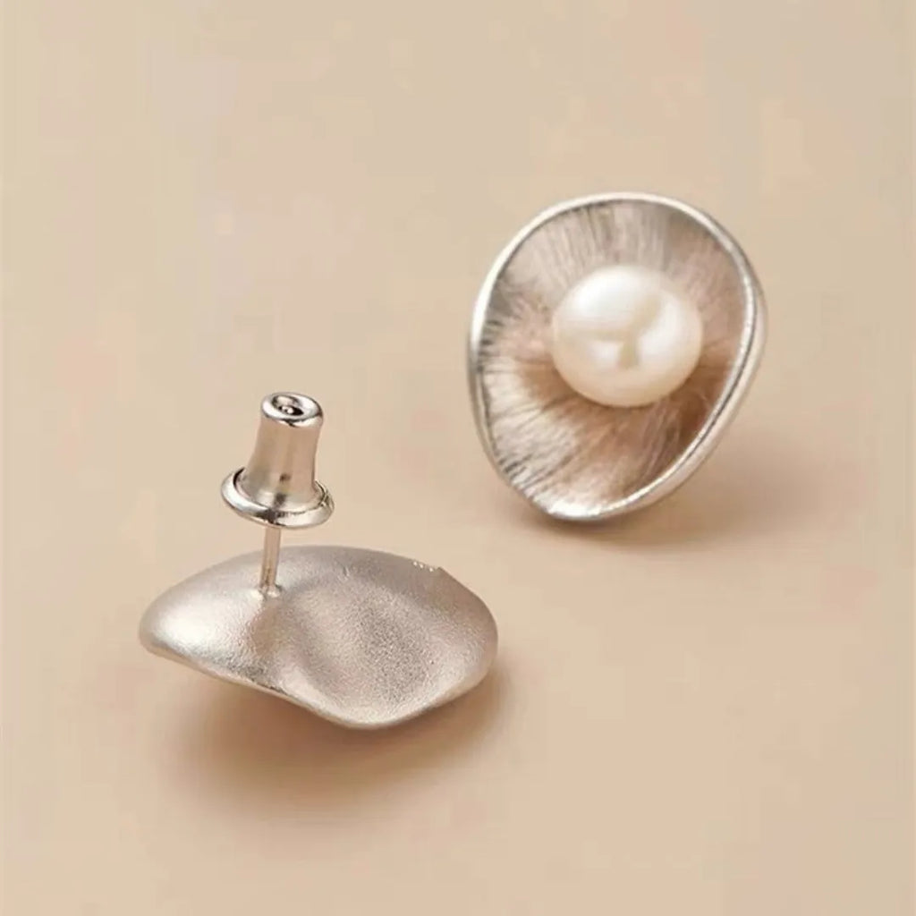 Gold geometric earrings with freshwater pearls on sterling silver posts and butterfly clasps