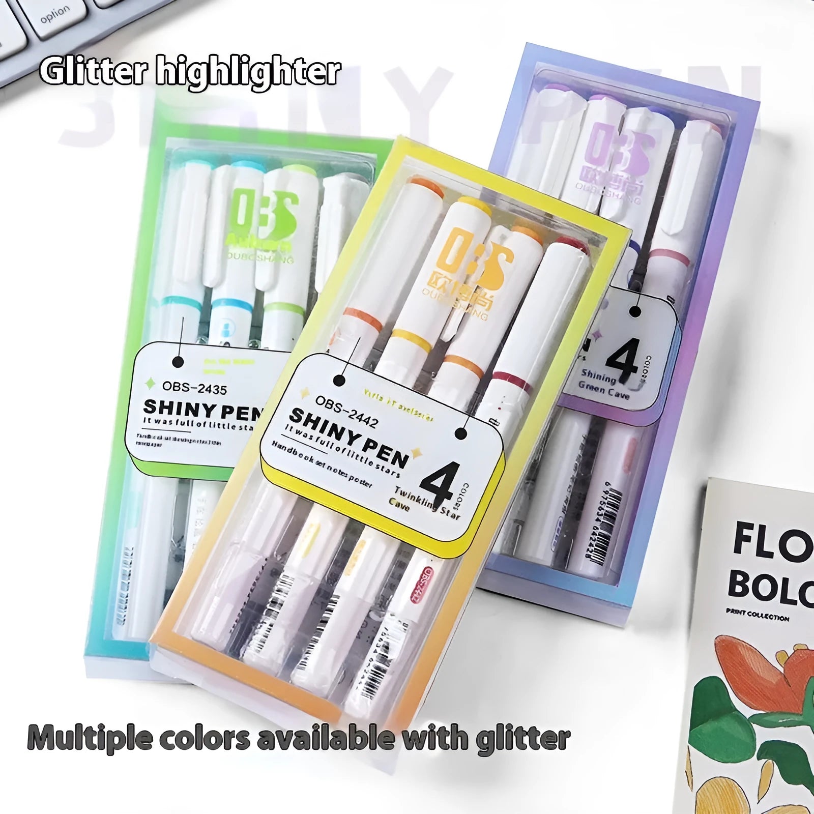 Four glitter highlighter pens with slanted tips in assorted fluorescent colours on a white background.