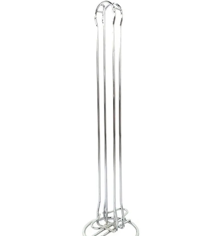 Black wrought iron coffee capsule storage rack holding 20 pods on a kitchen counter.
