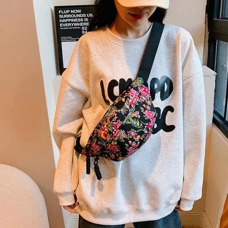 Western style women's waist bag with large flower design and contrast stitching in nylon