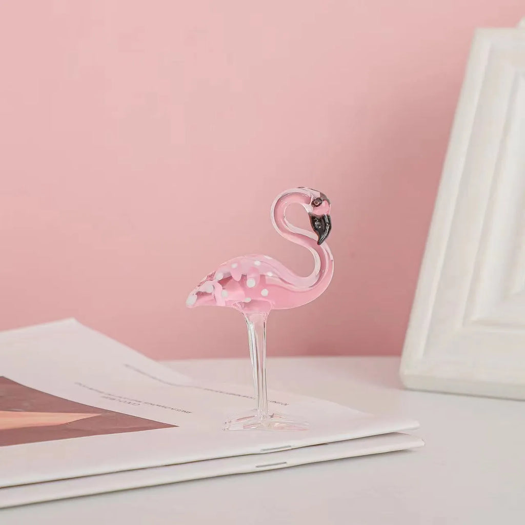 Pink flamingo crystal decorative figurine on a white base for modern home table decor.