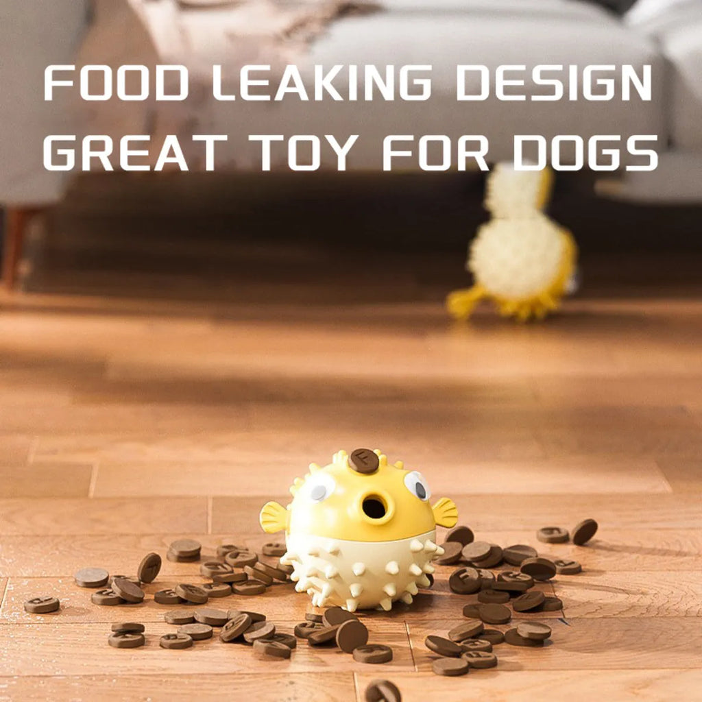 Yellow vinyl fish-shaped dog chew toy with textured surface and squeaker inside.