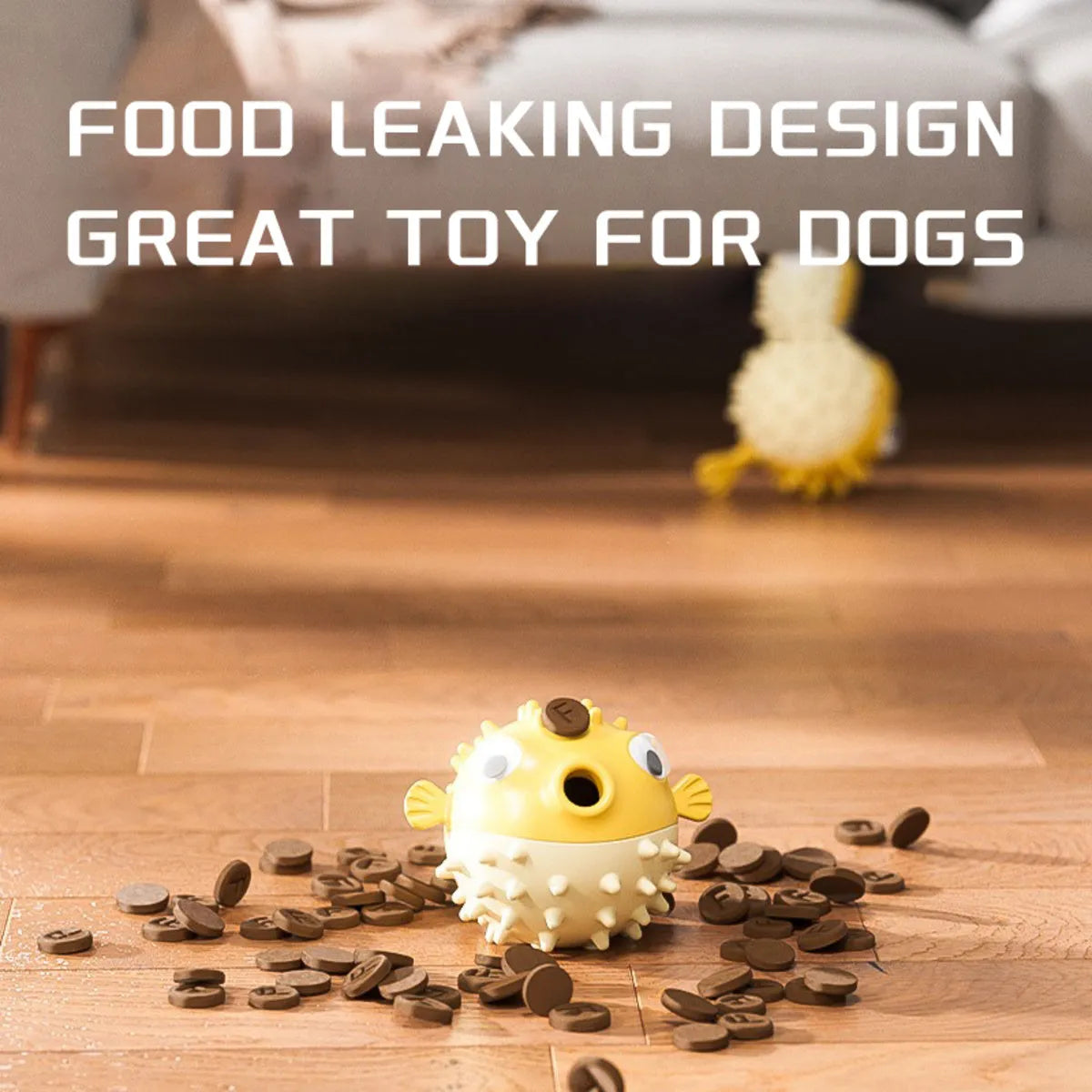 Yellow vinyl fish-shaped dog chew toy with textured surface and squeaker inside.