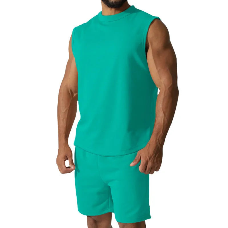 Men's sleeveless cotton blend sports top and matching shorts in a solid colour, laid flat.