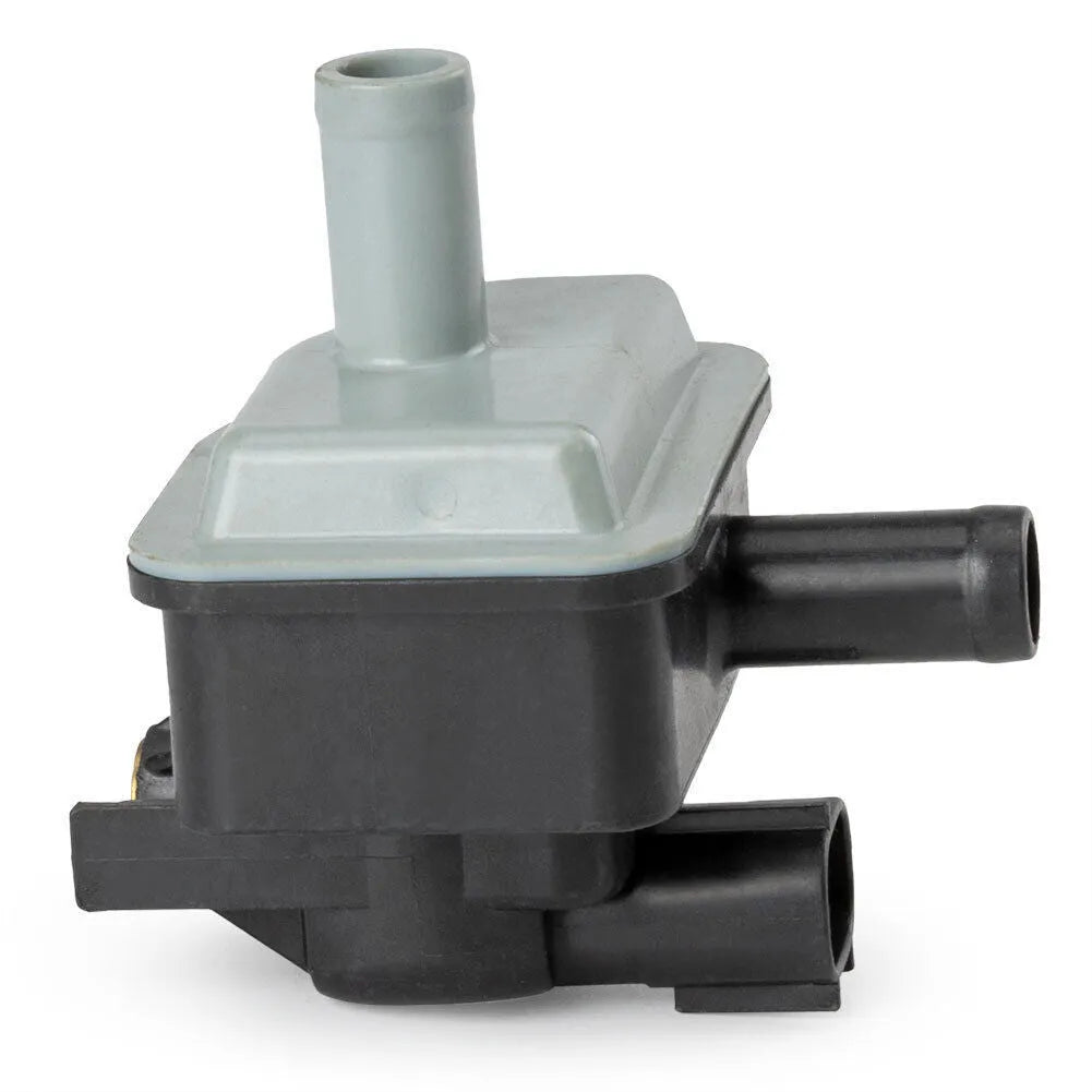 Black Toyota vacuum solenoid valve with model number 90910-12283 visible
