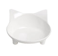 Shallow black melamine cat bowl with non-slip rubber base on a kitchen floor