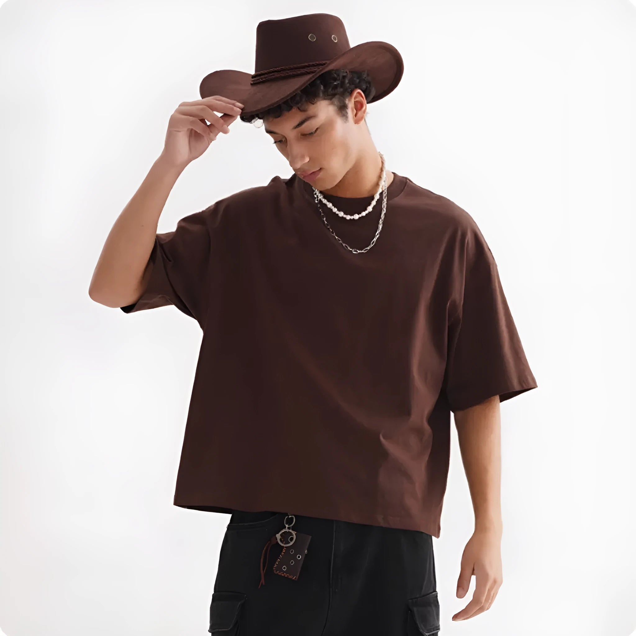 American style loose fit pure cotton T-shirt shown in apricot colour on a model.