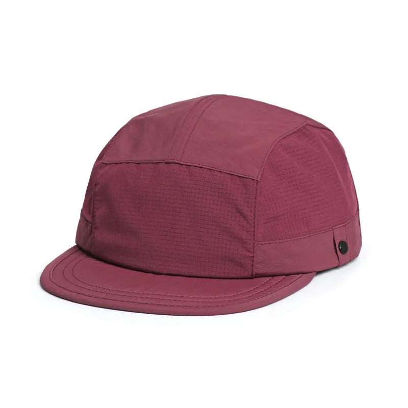 Breathable dome crown sun cap with a soft front tongue in Army Green colour on a wooden background.