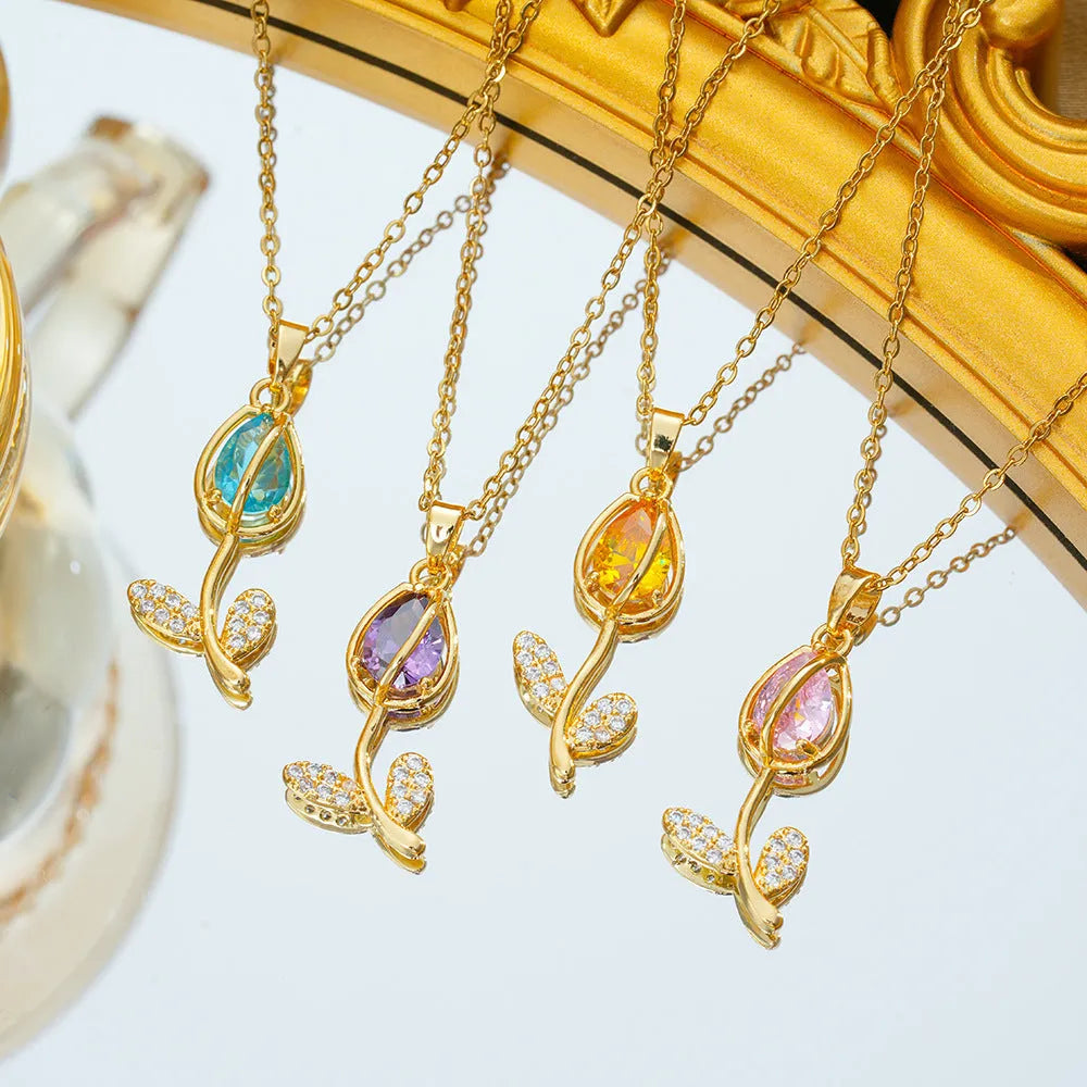 Gold-toned tulip flower zircon pendant on an adjustable O-ring chain necklace for women.