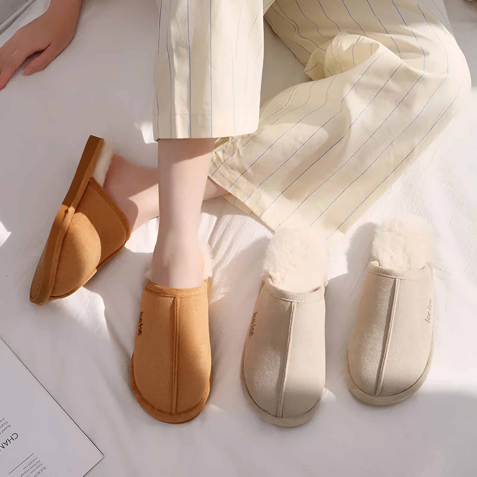 Pair of warm plush cotton slippers with TPR sole in beige on a tiled floor