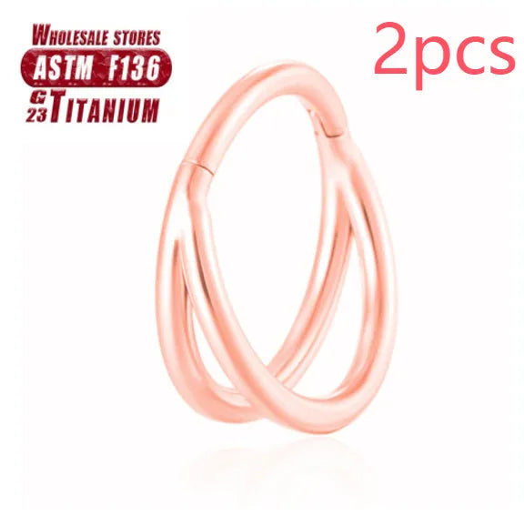 Titanium alloy fork nose ring in silver colour on a grey background