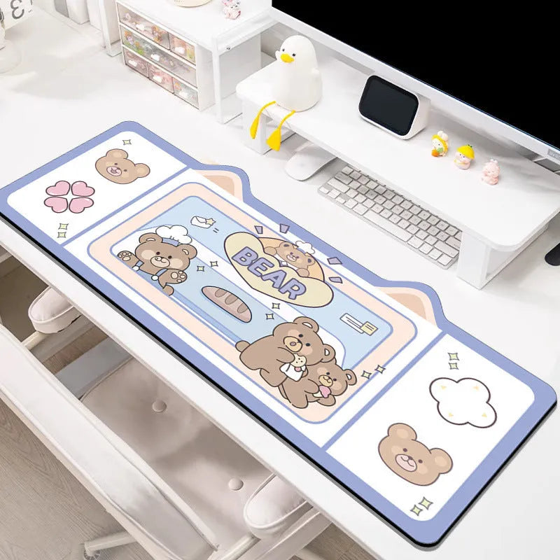Natural rubber oversized desk pad showing pink bunny, purple bear, and purple kitten colour options