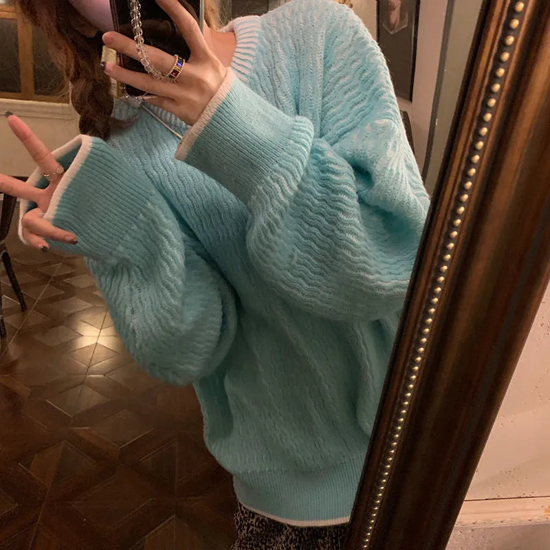 Women's loose retro pullover sweater in lake blue, purple, or pink, showing regular sleeves and a solid colour design.