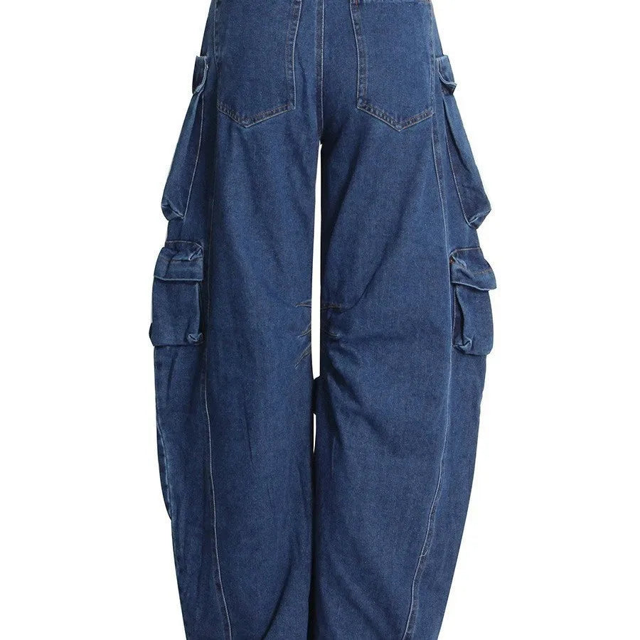 Dark blue distressed women's wide-leg jeans with a high waist and multiple pockets on a neutral background.