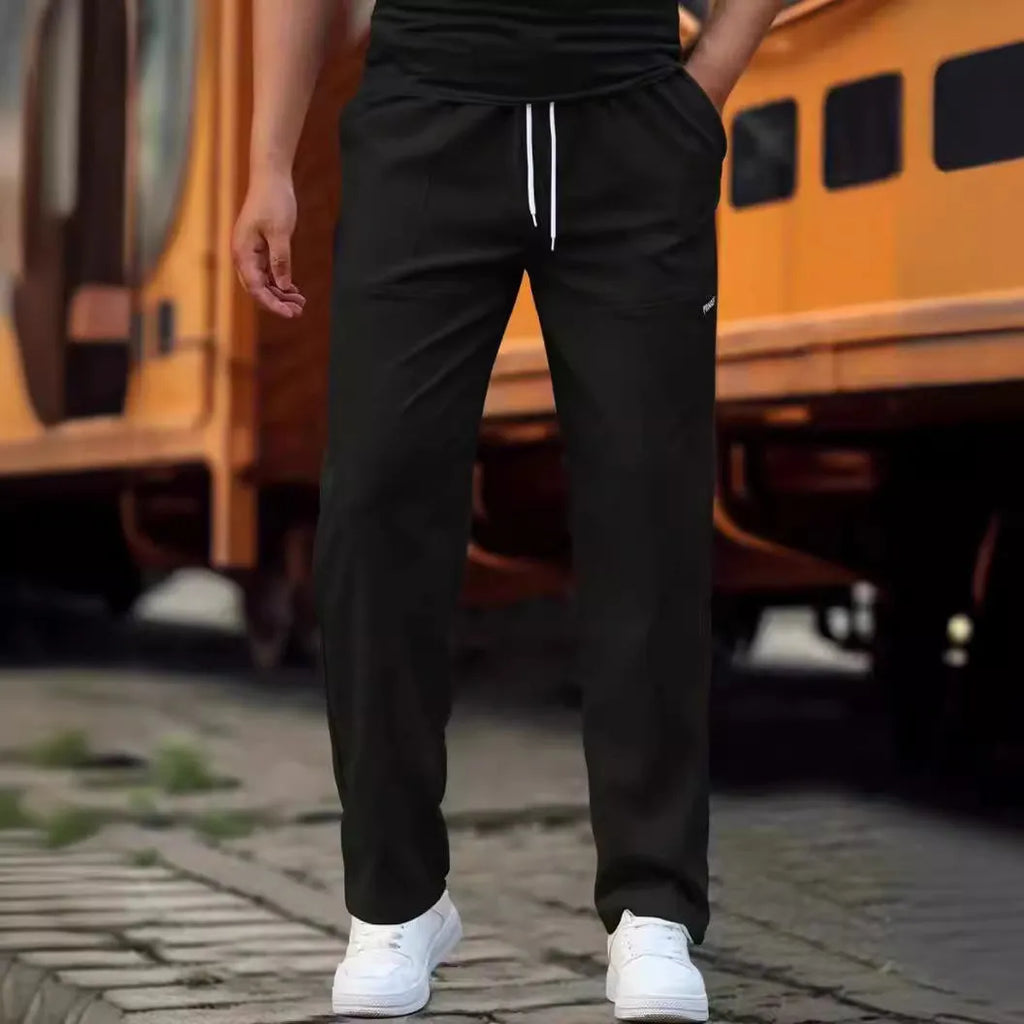 Men's light grey polyester casual trousers for spring and autumn wear.