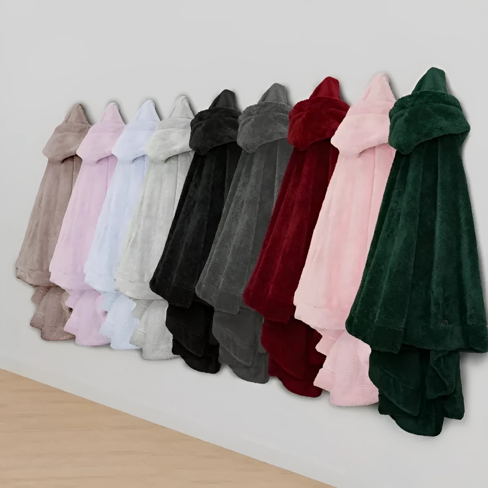 A hooded, long sleeve bathrobe in a cardigan style, shown in a solid colour.