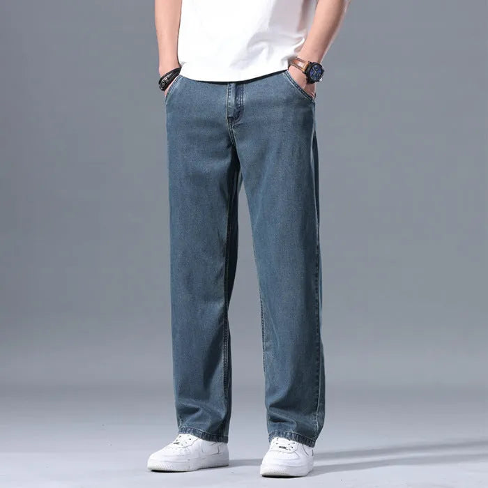 Men's loose straight leg jeans in lyocell blend fabric showing light blue colour option