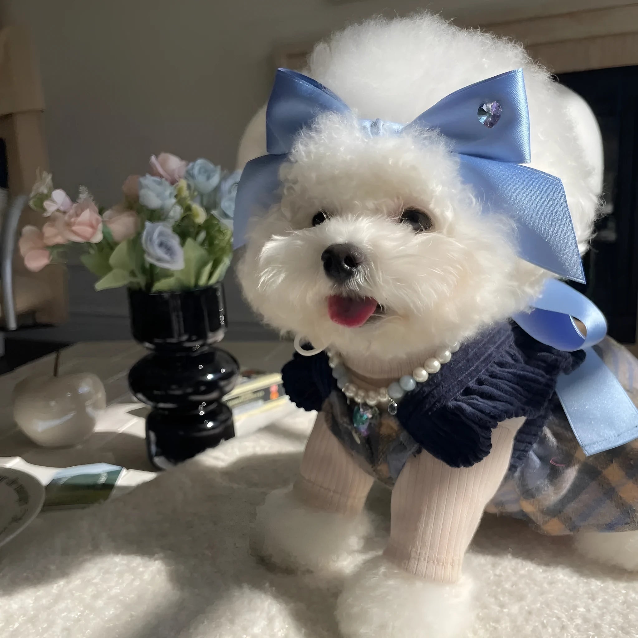 Blue and pink adjustable bow dog headdress hair band on a white background.