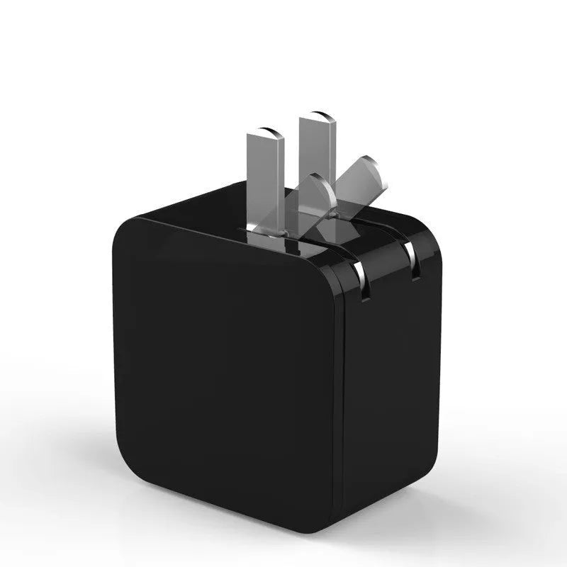 White dual USB travel wall charger with digital voltage display showing 5.0V, next to a smartphone.