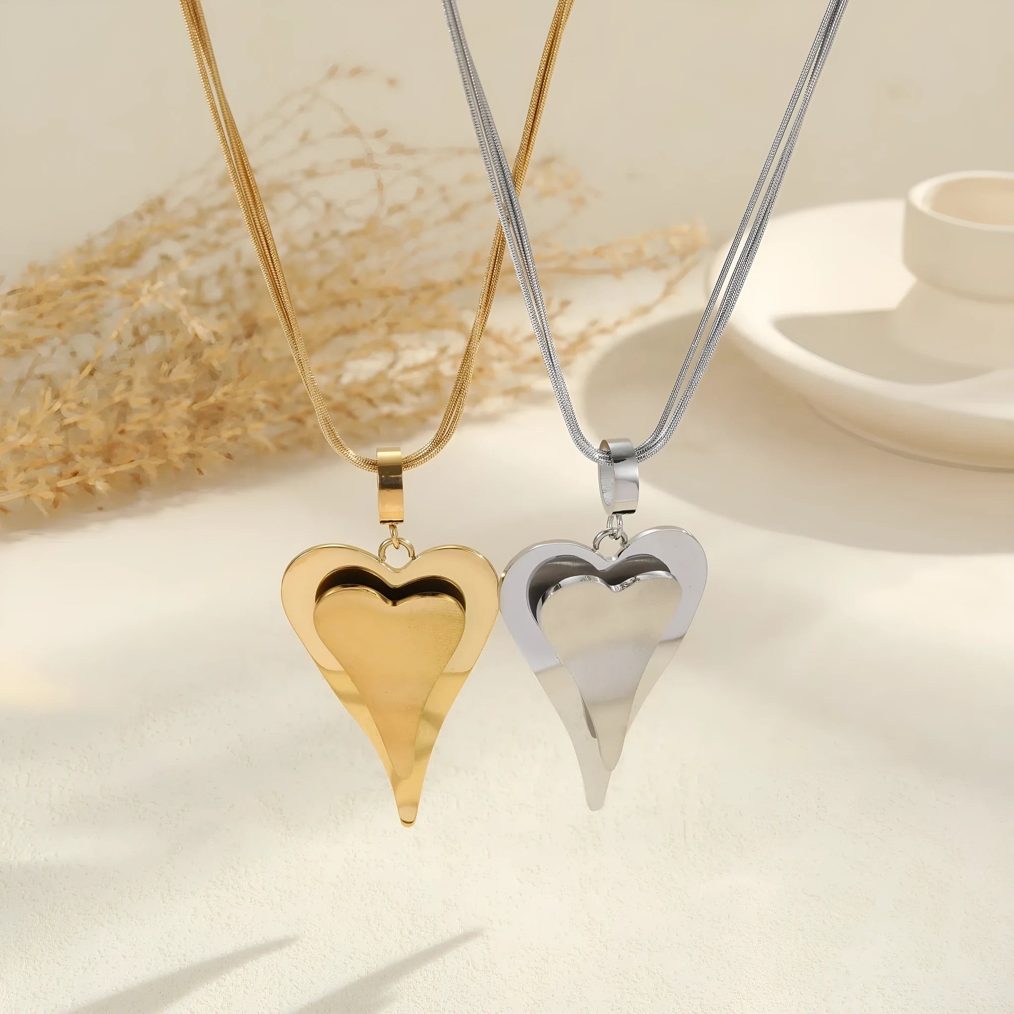 Double heart snake bones chain necklace in stainless steel with geometric pendant design