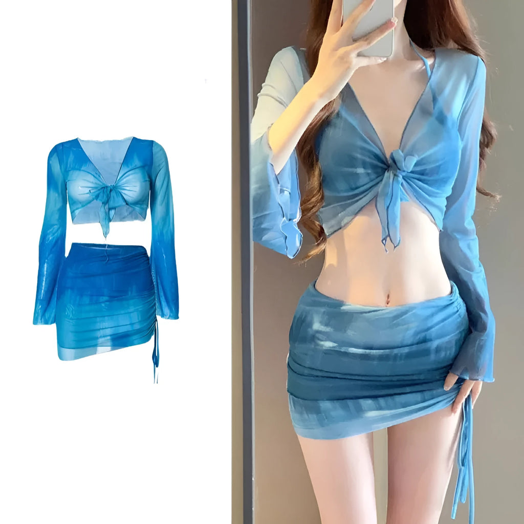 Blue women's high-waist bikini four-piece set showing shirt, bra, briefs, and skirt laid flat.