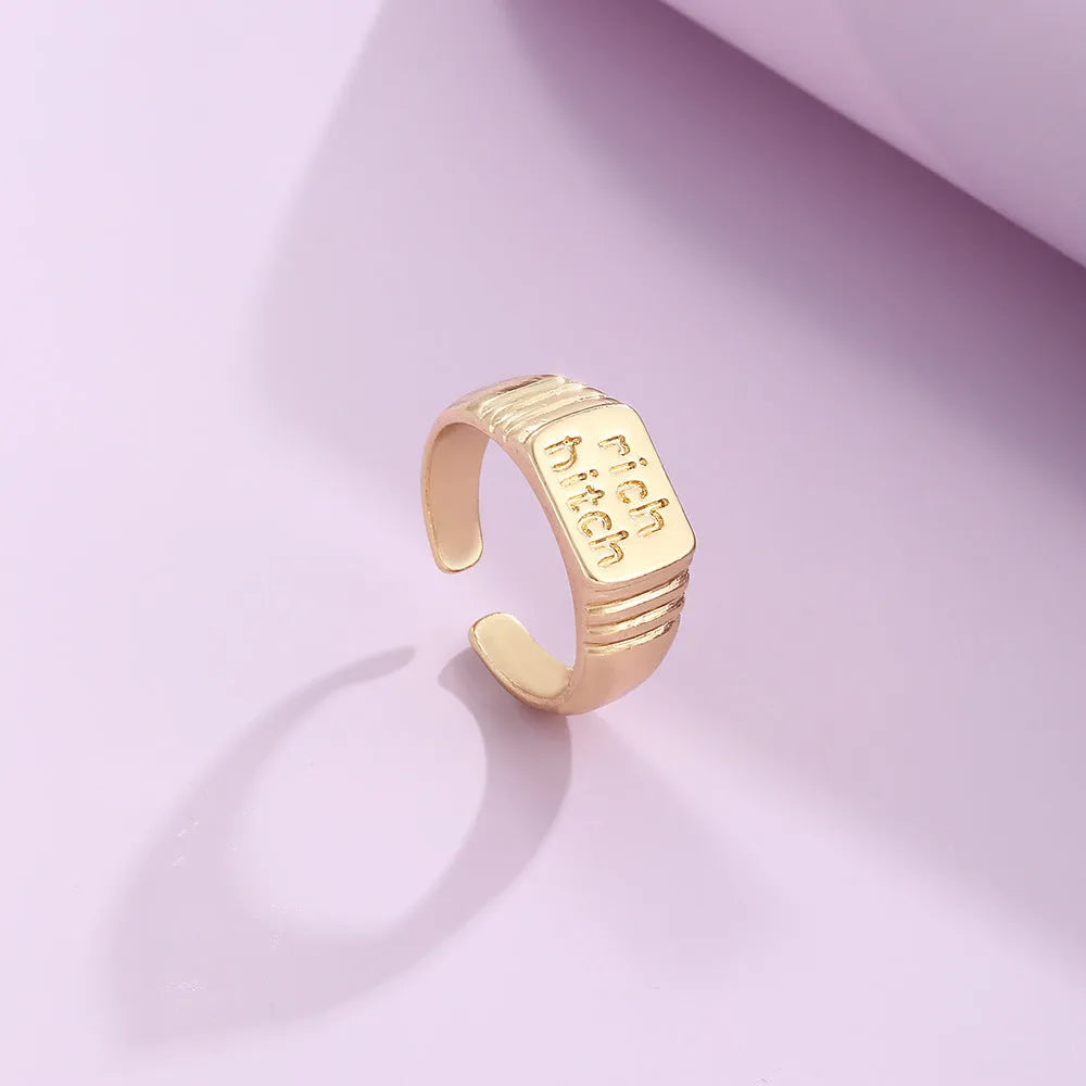 Vintage alloy ring set of four with heart shapes and letter cutouts, electroplated finish, colour JH1084