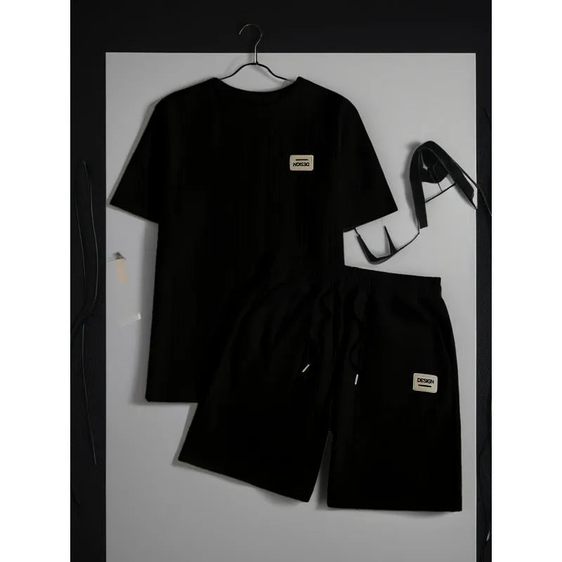 Men's wheat grain tassel knit two-piece set: grey hooded sweatshirt and matching shorts, front view on model