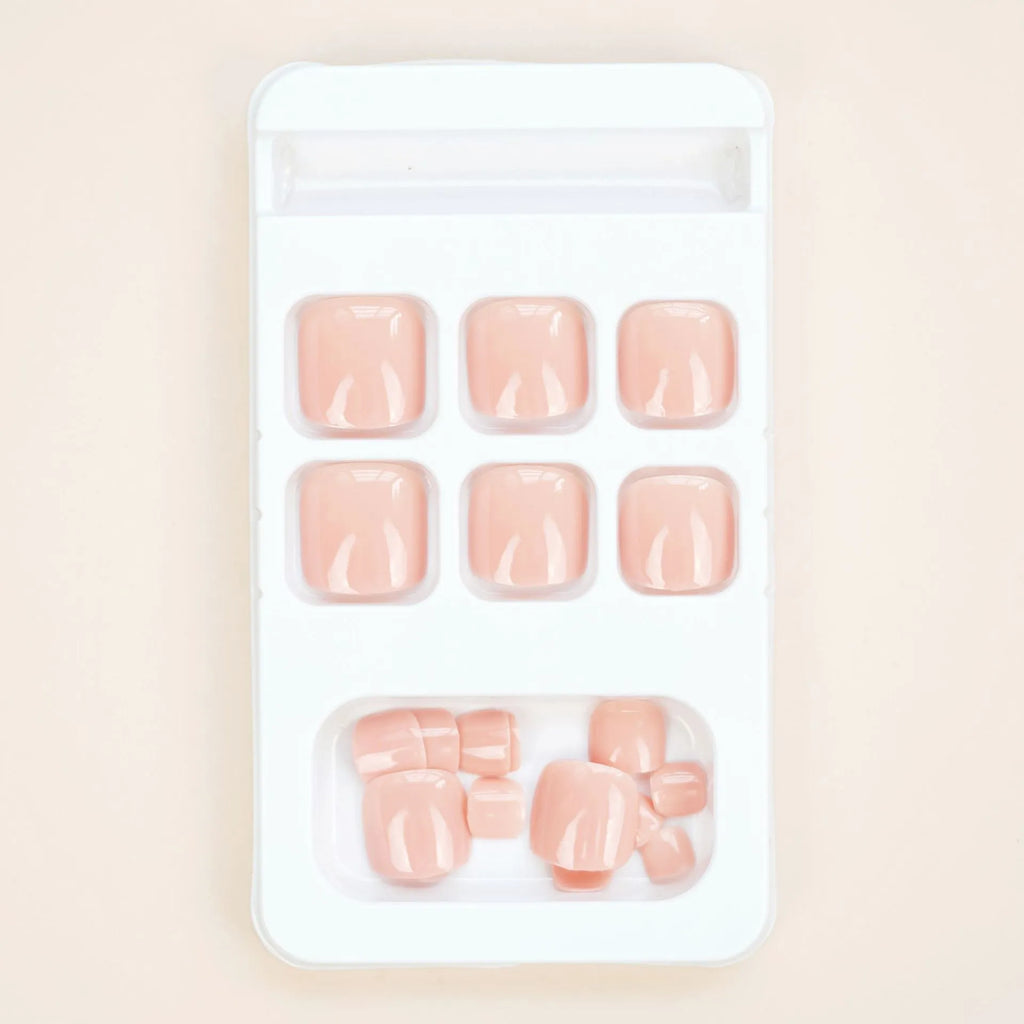 Skin colour glue-on false toe nail stickers in an ins style, supplied with adhesive.