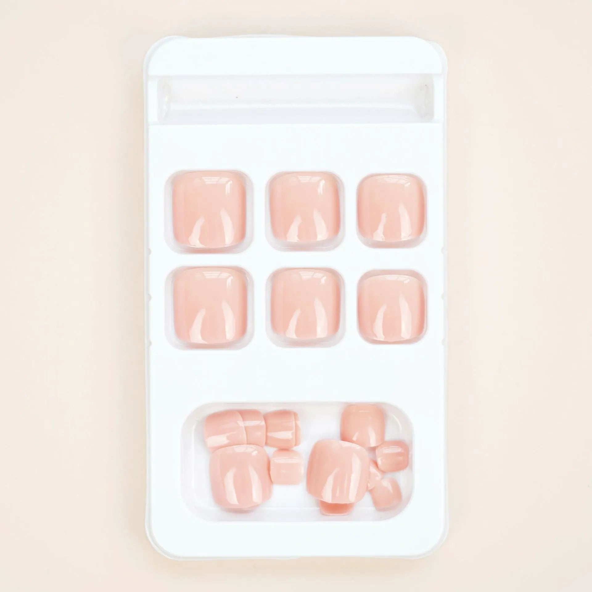 Skin colour glue-on false toe nail stickers in an ins style, supplied with adhesive.