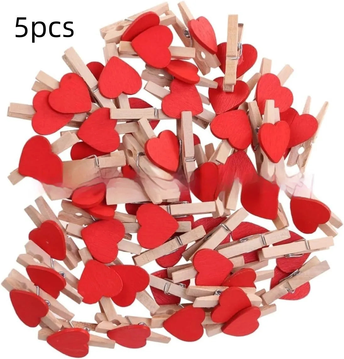 Five handmade solid wood heart-shaped hair clips in different colours on wooden surface