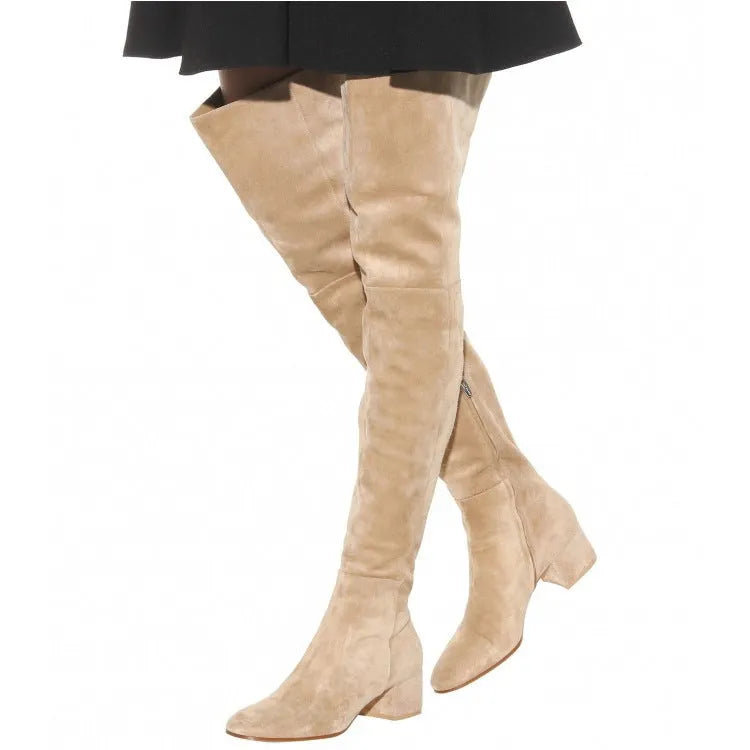 Grey suede women's over-the-knee flat boots with a pointed toe and thick low heel on a neutral background.