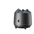 White volcanic-shaped ultrasonic humidifier and aromatherapy diffuser with USB cable on a table.