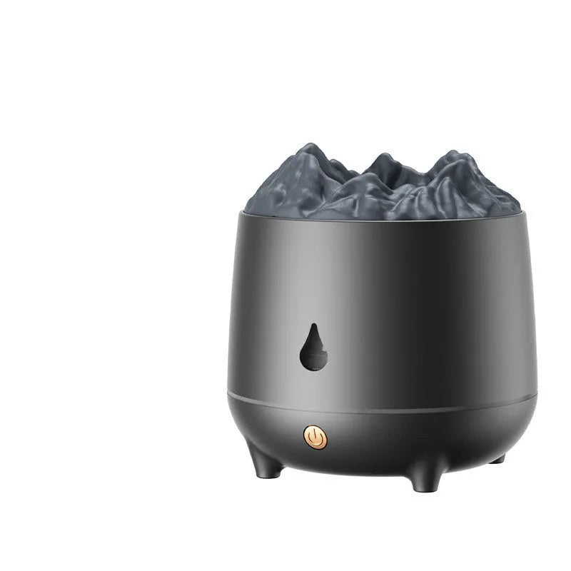 White volcanic-shaped ultrasonic humidifier and aromatherapy diffuser with USB cable on a table.