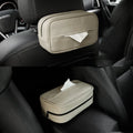 Black PU leather box with hanging loop on a car seat.