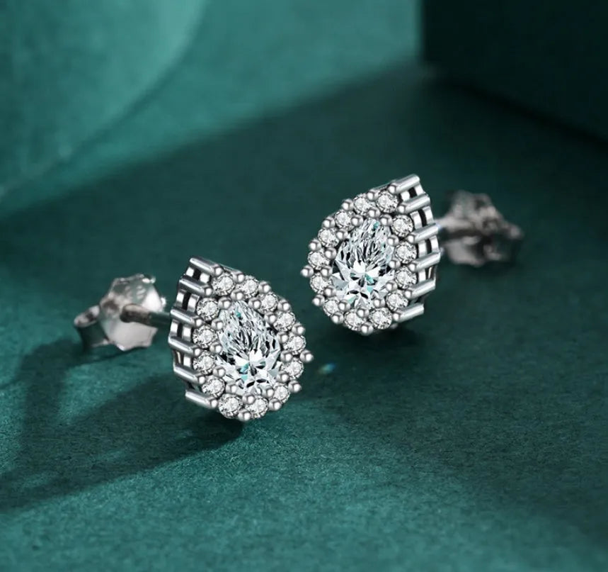 Women's silver water drop ear studs in 925 sterling silver with diamond treatment finish