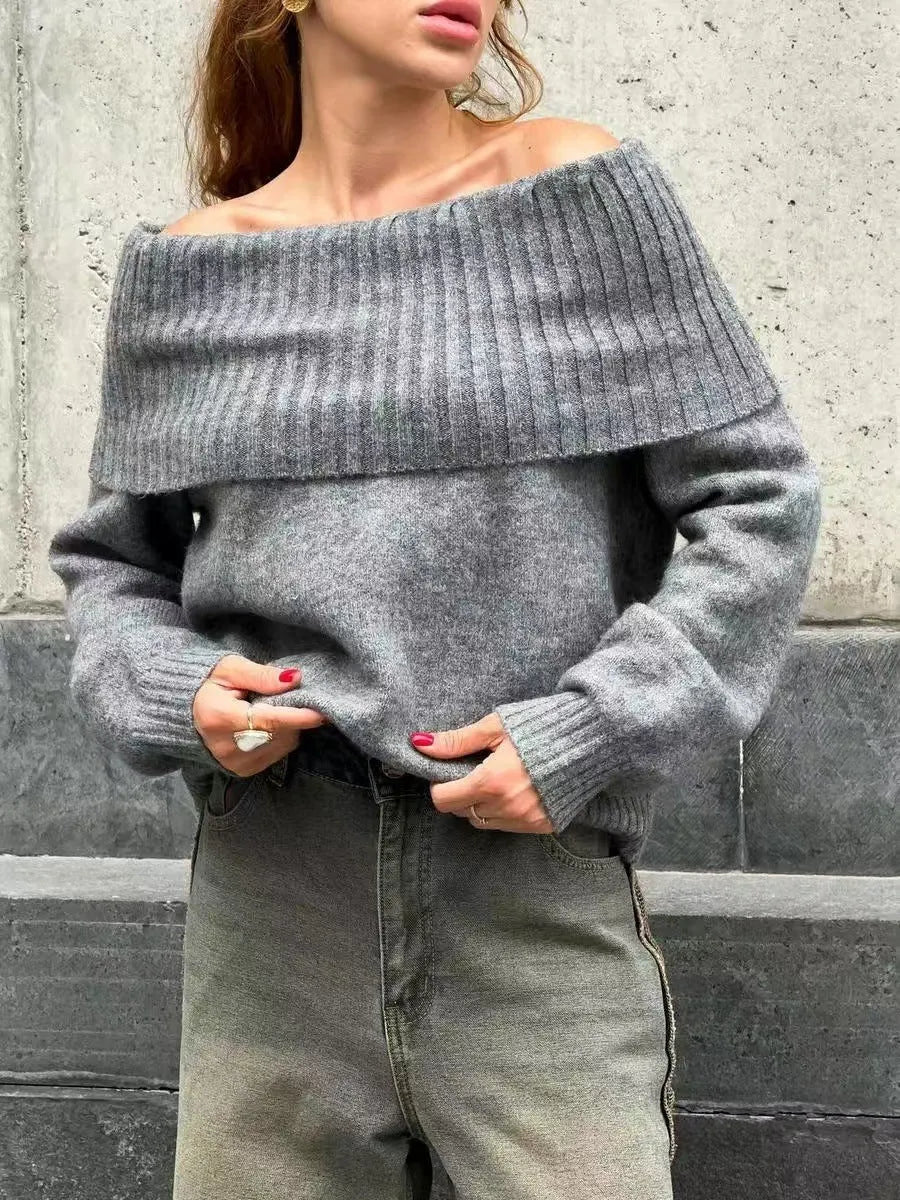 Grey off-the-shoulder sweater with a 3D textured pattern, shown on a model.