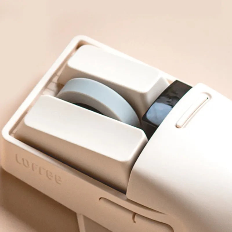 Xiaoqiao Tofu coloured three-mode wireless mouse with ergonomic shape on a desk.