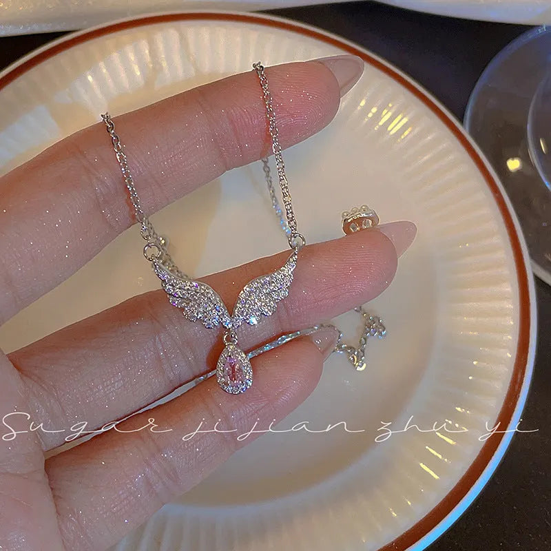 Women's S925 sterling silver adjustable necklace with choice of angel wing or fishtail pendant on O-ring chain