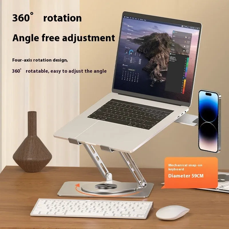 Silver carbon steel laptop stand with rotating magnetic phone holder mounted beside 17-inch laptop